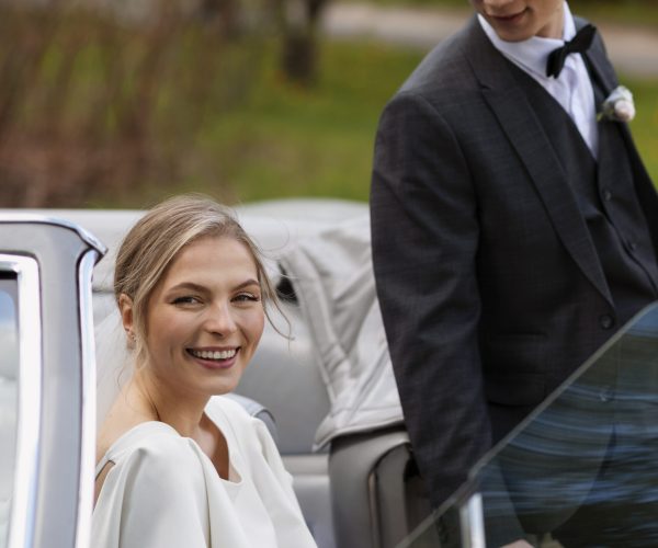 just-married-couple-with-their-car